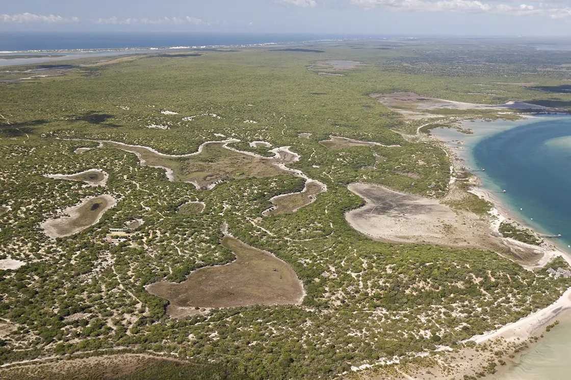 Perfect Hideaways real estate property: An aerial photograph of the San Sebastian Peninsula in Mozambique. The Sanctuary Private Reserve, Mozambique.