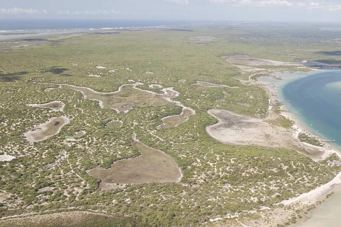 Perfect Hideaways real estate property: An aerial photograph of the San Sebastian Peninsula in Mozambique. The Sanctuary Private Reserve, Mozambique.