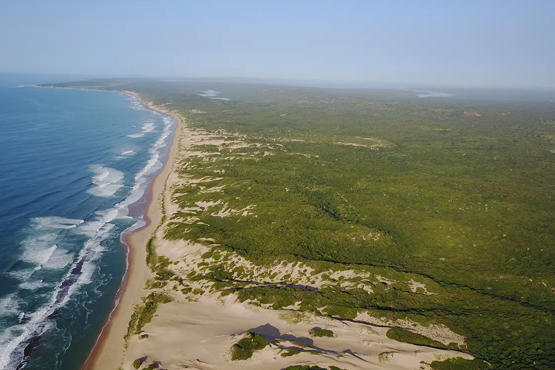 Perfect Hideaways real estate property: An aerial view of the whole bay and the outstretched Mozambican coastline. Dunes de Dovela Lodge, Mozambique.