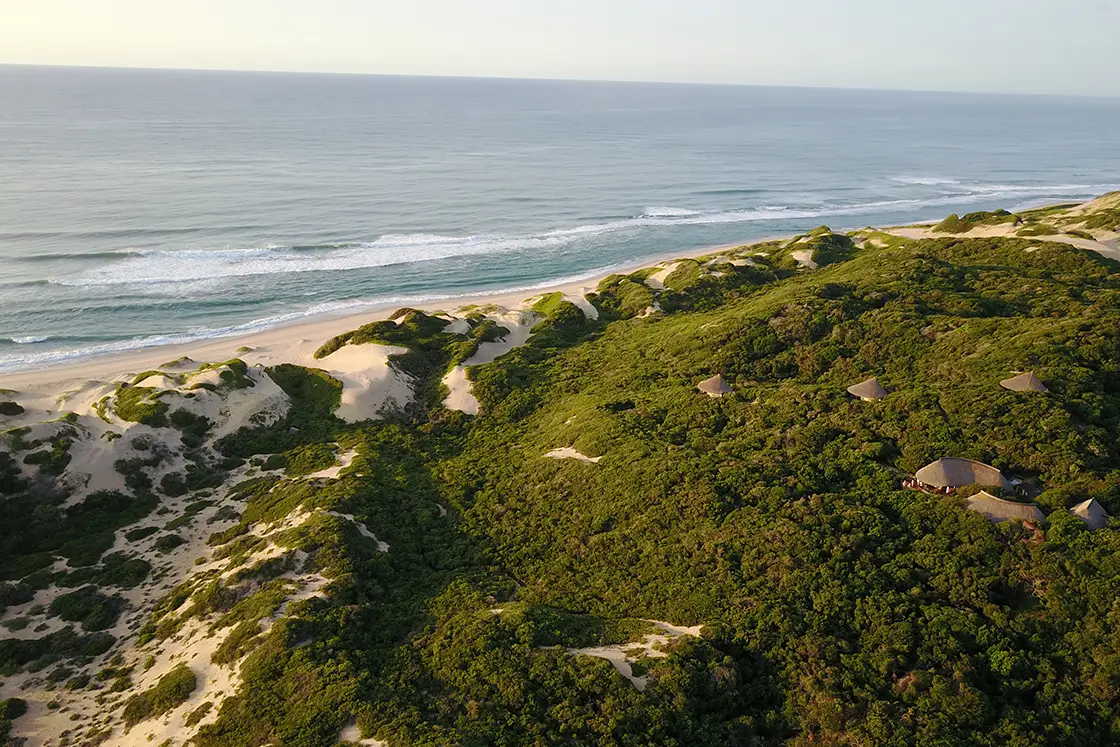 Perfect Hideaways real estate property: The beach lodges are positioned on the hilltop of the sand dunes with the sea spread out in front. Dunes de Dovela Lodge, Mozambique.