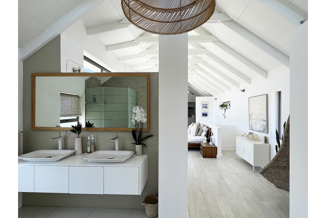 An en-suite bathroom in the bedroom white walls and a ceiling.