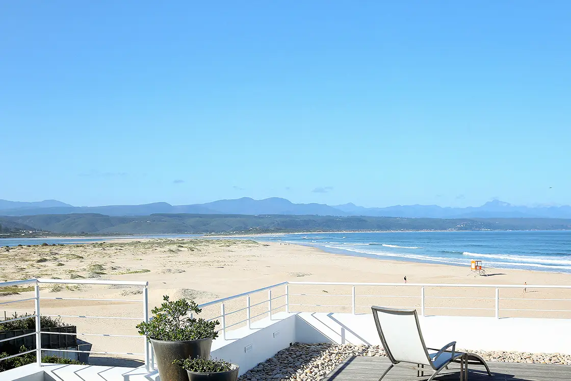 Perfect Hideaways real estate property: A landscape view of Lookout Beach in Plettenberg Bay, seen from the deck of a beach house. Roga Rock, Plettenberg Bay.