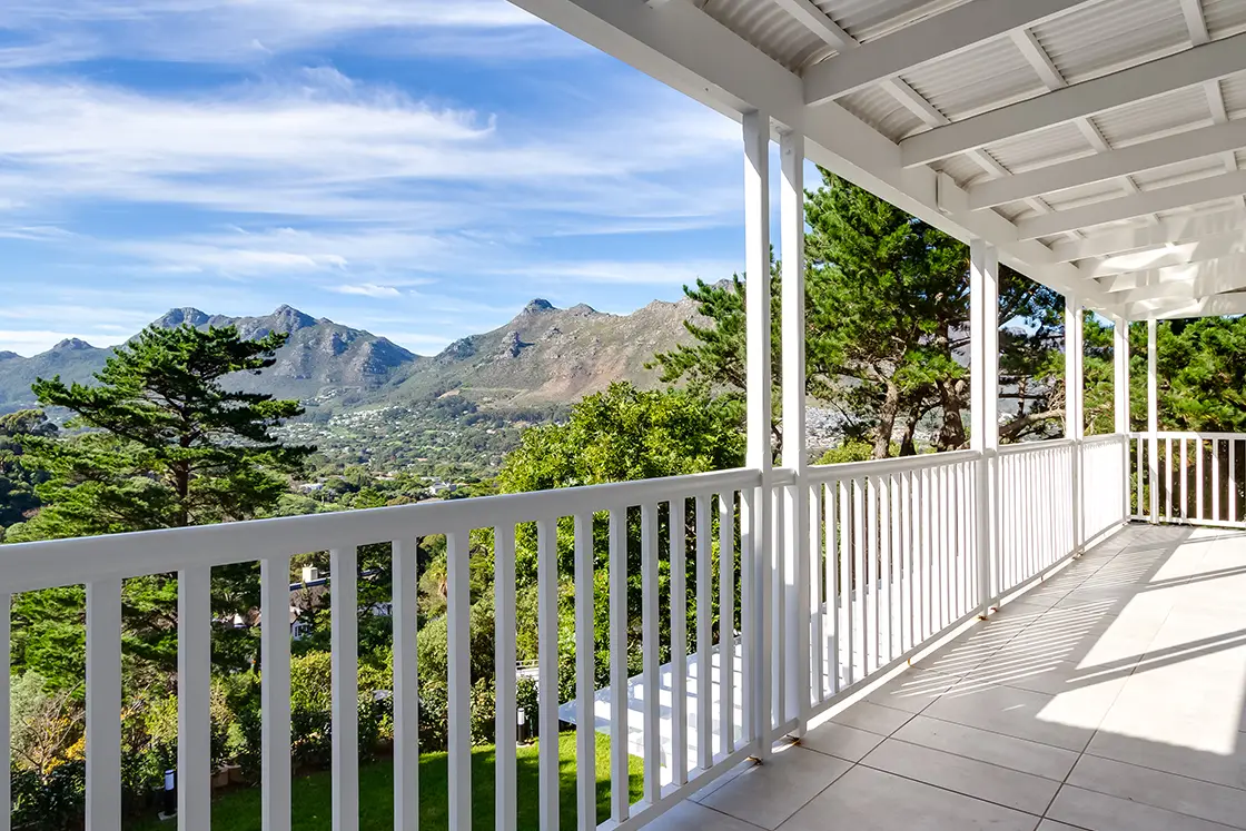 Perfect Hideaways real estate property: Expansive views of the mountains in Hout Bay from the second-floor balcony. The Berg Manor and Villas, Hout Bay.