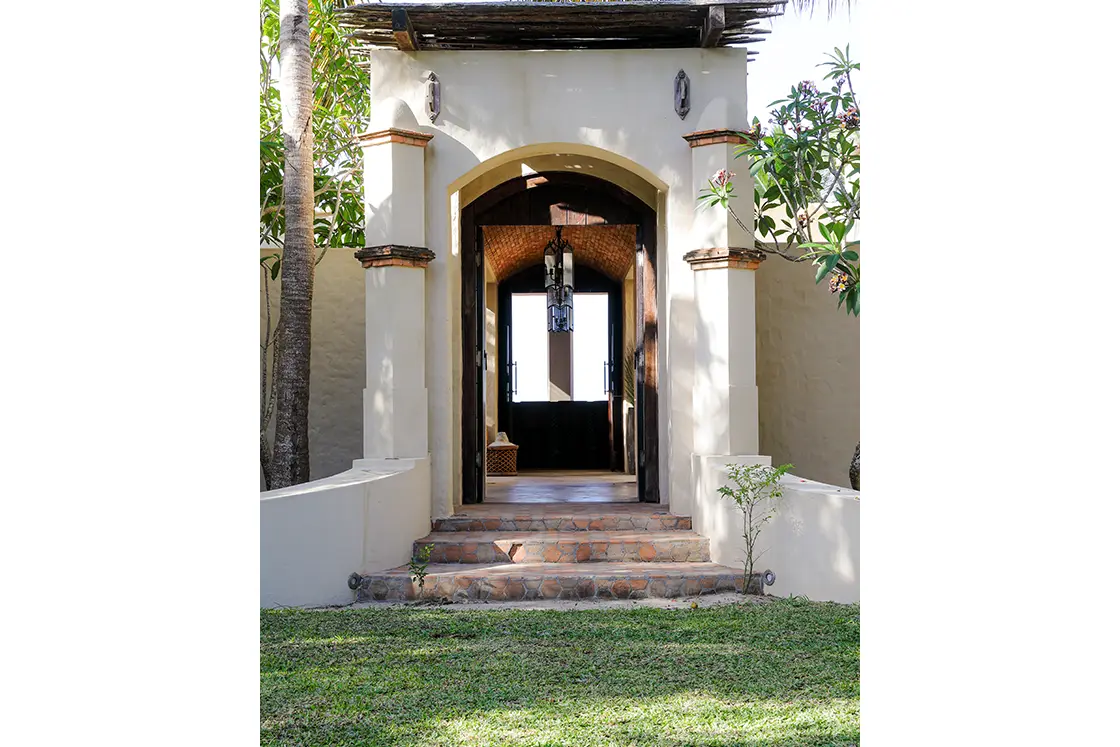 Perfect Hideaways real estate property: The grand entrance to a private villa, showcasing the Moroccan architectural style. Villa Tanga, Benguerra Island.