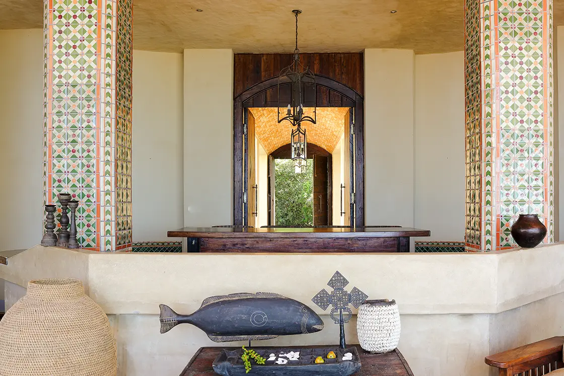 Perfect Hideaways real estate property: A spacious living area, featuring tiled pillars in a Moroccan style, and Mozambican decor. Villa Tanga, Benguerra Island.