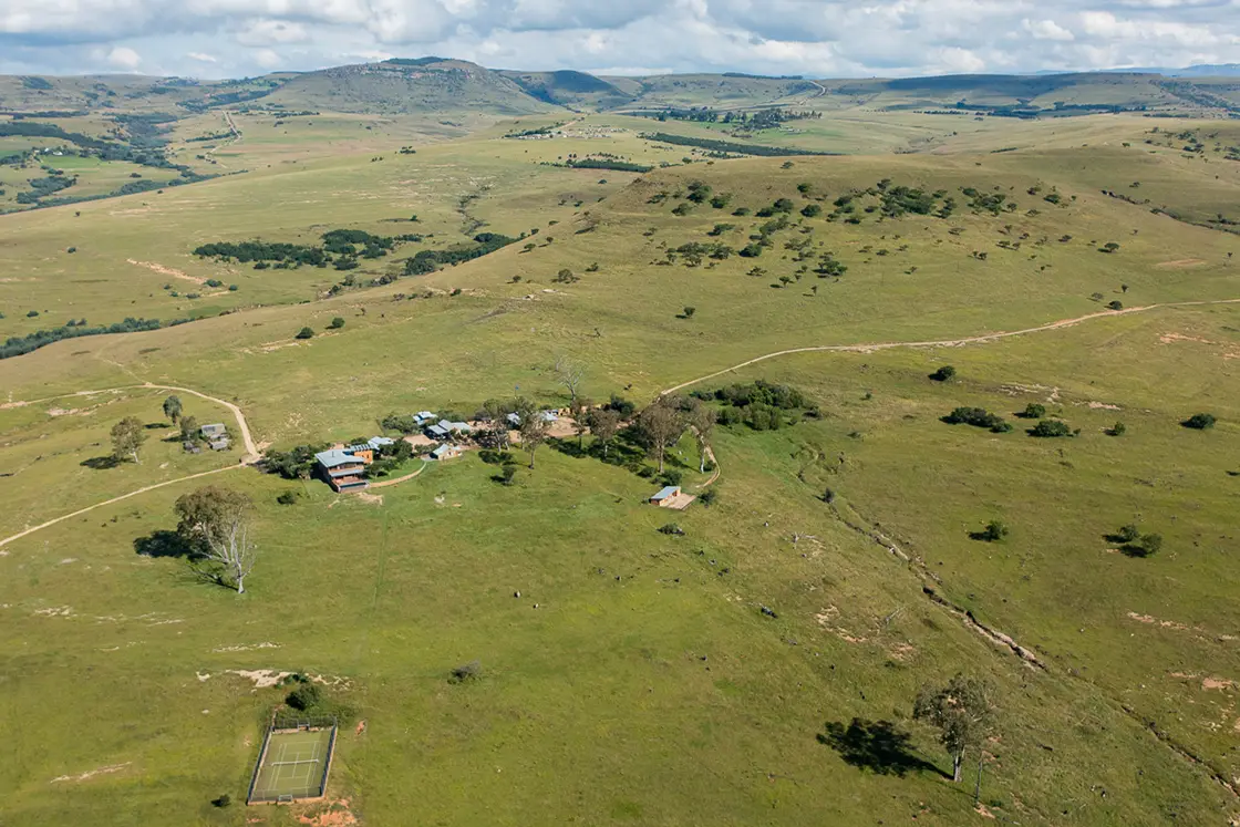 Perfect Hideaways real estate property: An aerial view of the game lodge, showcasing rolling hills stretching to the horizon. Zulu Waters Game Reserve, Natal Midlands.