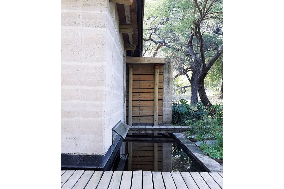 Perfect Hideaways real estate property: A rustic home, featuring a moat with a wooden bridge. Otto House, Okavango Delta.