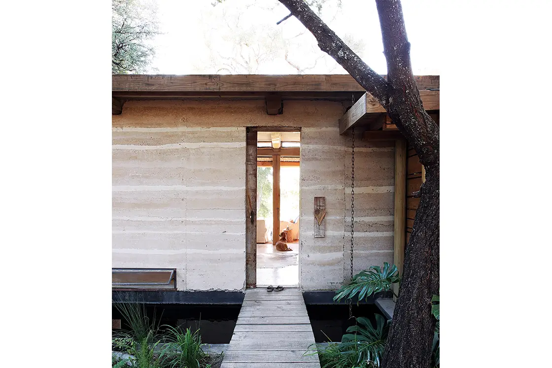 Perfect Hideaways real estate property: A home, featuring walls in a rammed earth construction style, and rustic decor elements. Otto House, Okavango Delta.