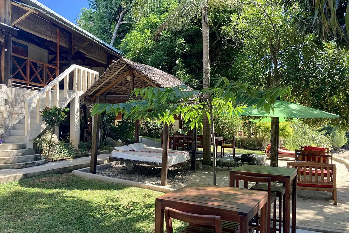 Perfect Hideaways real estate property: An outdoor seating and entertainment area at the foot of steps, which lead to the nearby lodge. Komba Eco Lodge, Madagascar.