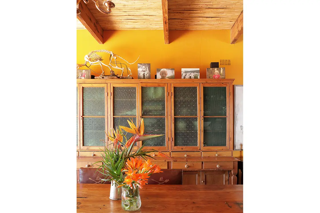 Perfect Hideaways real estate property: Wooden cupboards with frosted glass doors and small drawers the cupboard is adorned with photographs and decorative elements. Zeekoegat Farm in Riversdale.