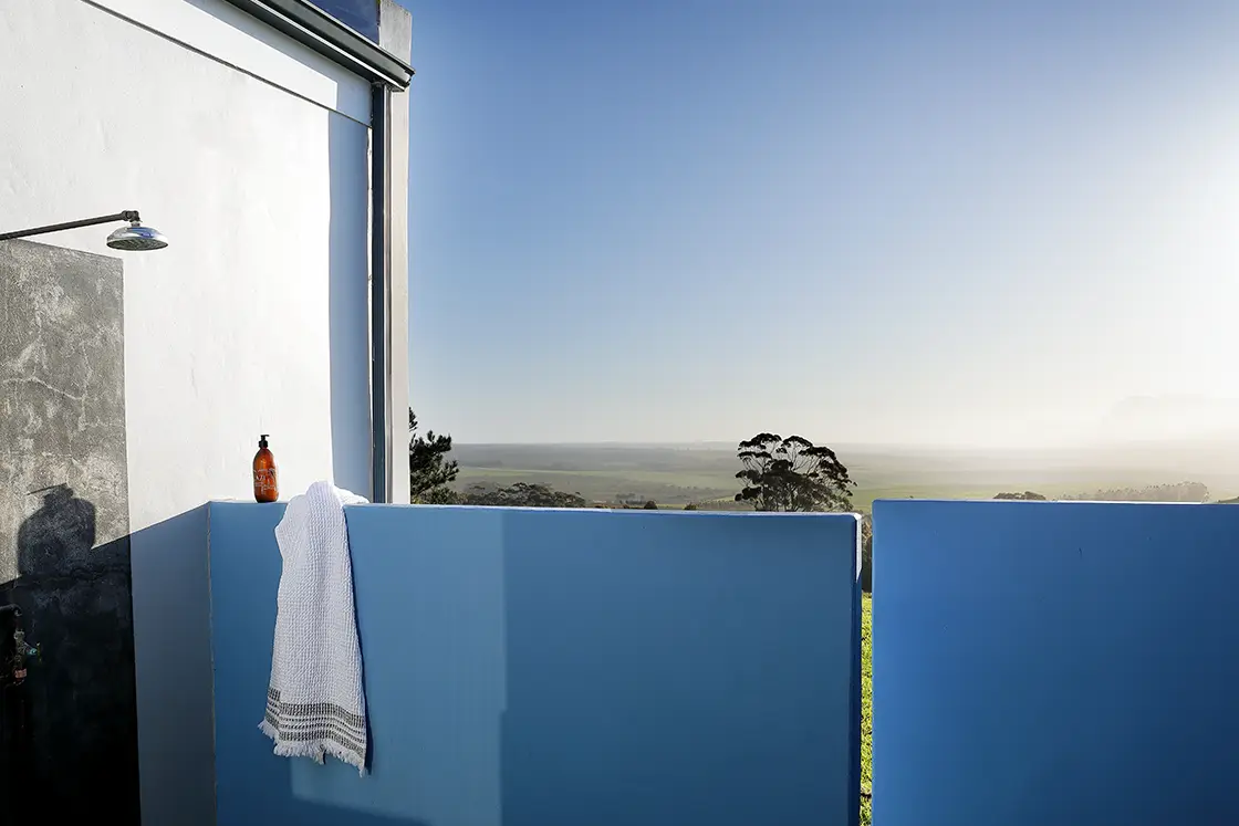 Perfect Hideaways real estate property: An outdoor shower with a view of the mountain range and valley. HaesFarm in Stanford.