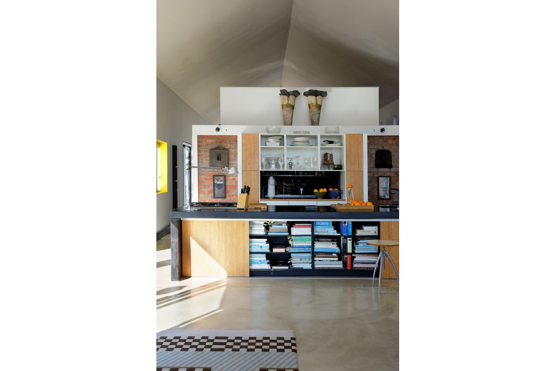 A spacious kitchen featuring a large island and contemporary art pieces.