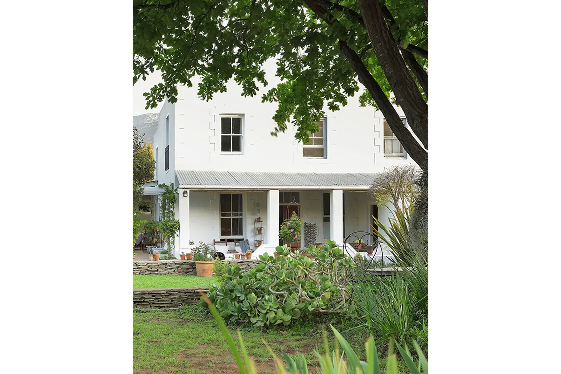 Perfect Hideaways real estate property: Heritage house with cottage-style windows, comfortable veranda, and organized garden. The White House in Barrydale.