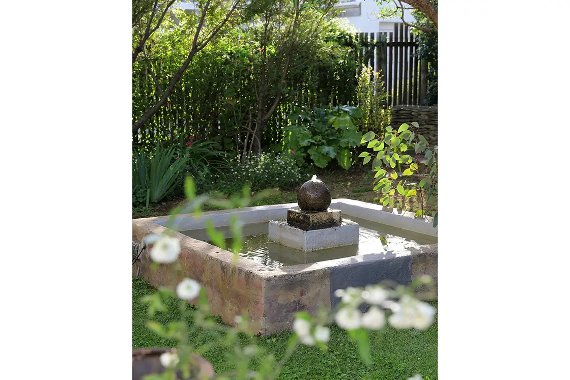 Perfect Hideaways real estate property: Garden water features in lush gardens. The White House in Barrydale.