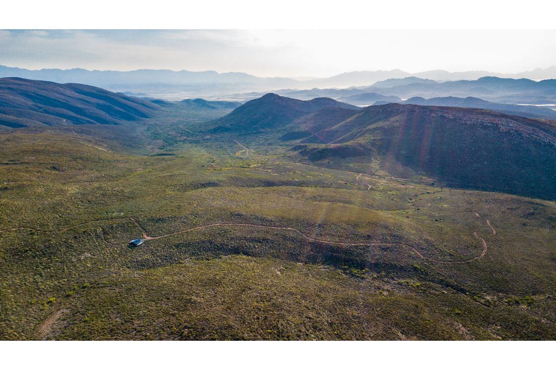 A dirt road leading to the small homestead, situated amongst the undulating hills of the Overberg.